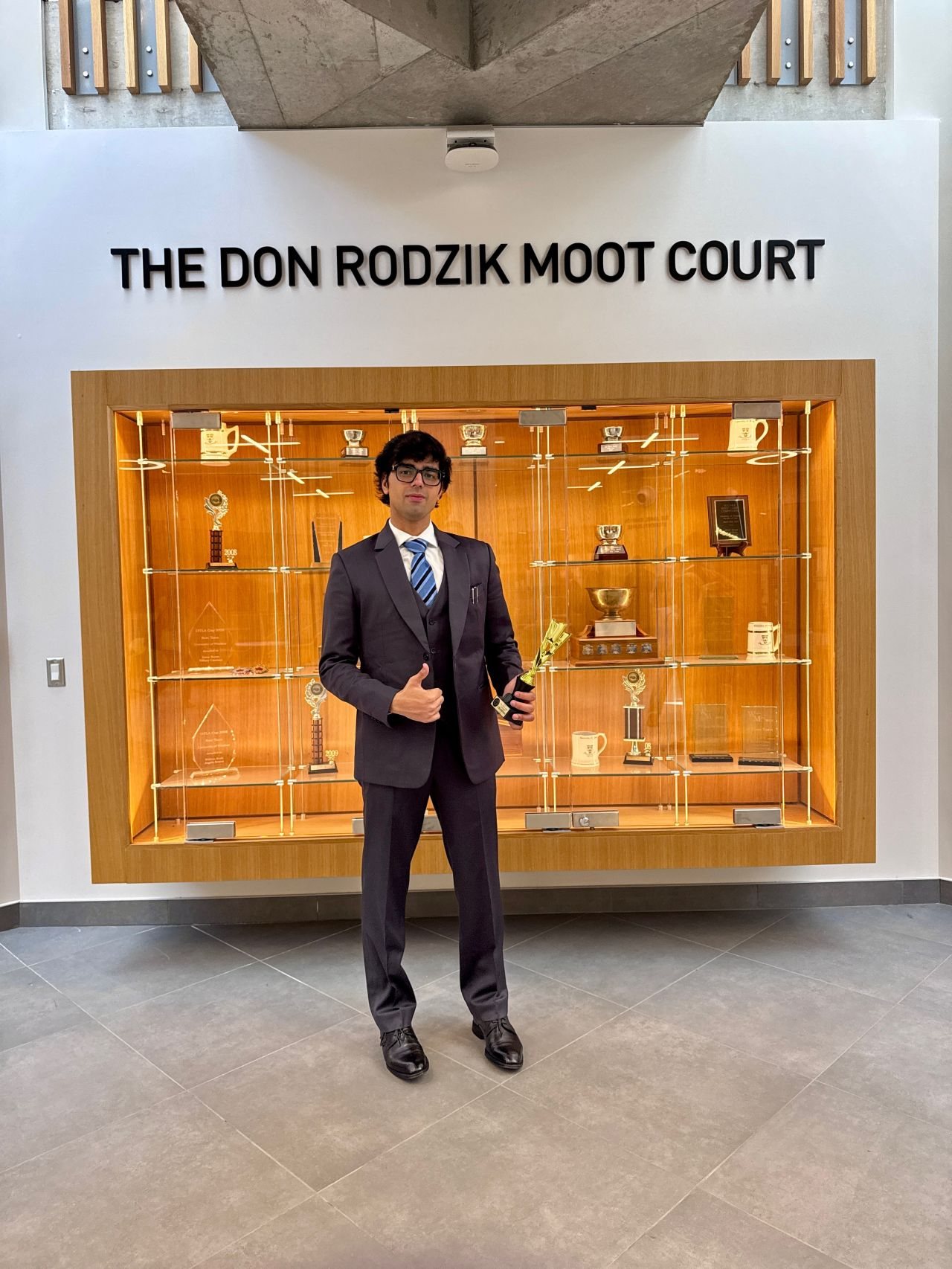 Abhilaksh with the November Moot trophy
